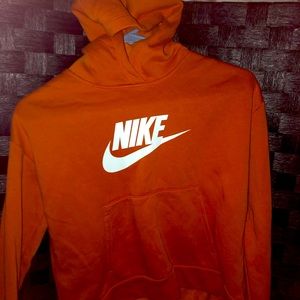Nike orange hoodie. Never worn. Cl kids size but a small for adults